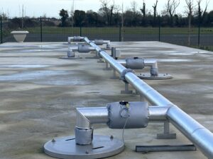 Pipework insulated with fiberglass rockwool sections and clad with aluminium in a waste water treatment facility in Cork