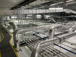 Ventilation ducting and water services pipework insulated with foiled fiberglass by Lagforce in Naas in Kildare