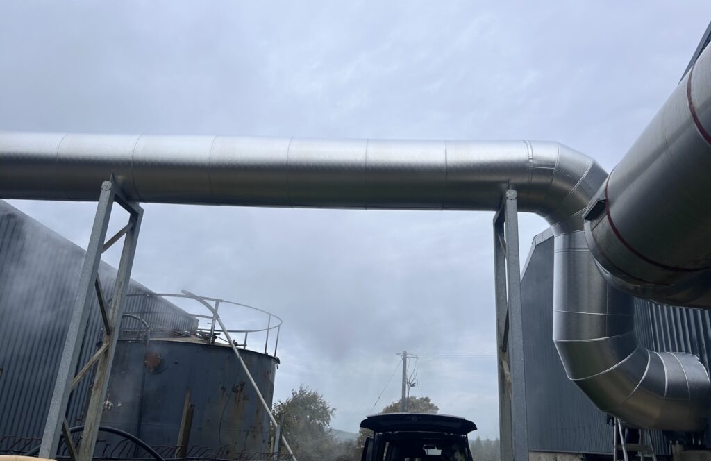 Insulated boiler flue with formed aluminium bend into a large-diameter flue section, Co. Meath
