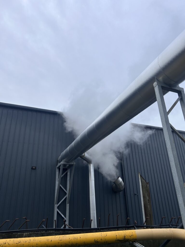 Boiler flue carried on a steel support frame between buildings, Co. Meath