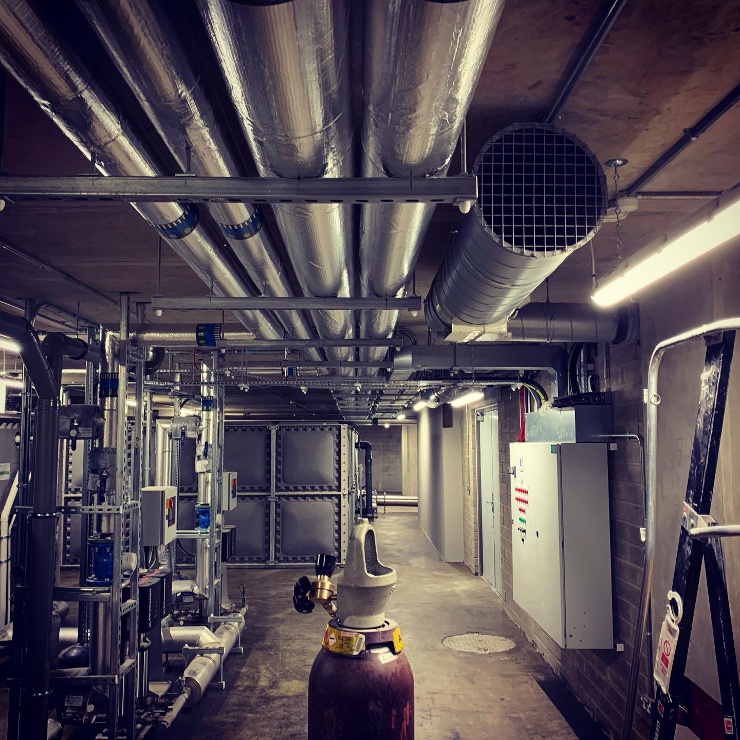 Insulated pipework and mechanical services in an underground plant area