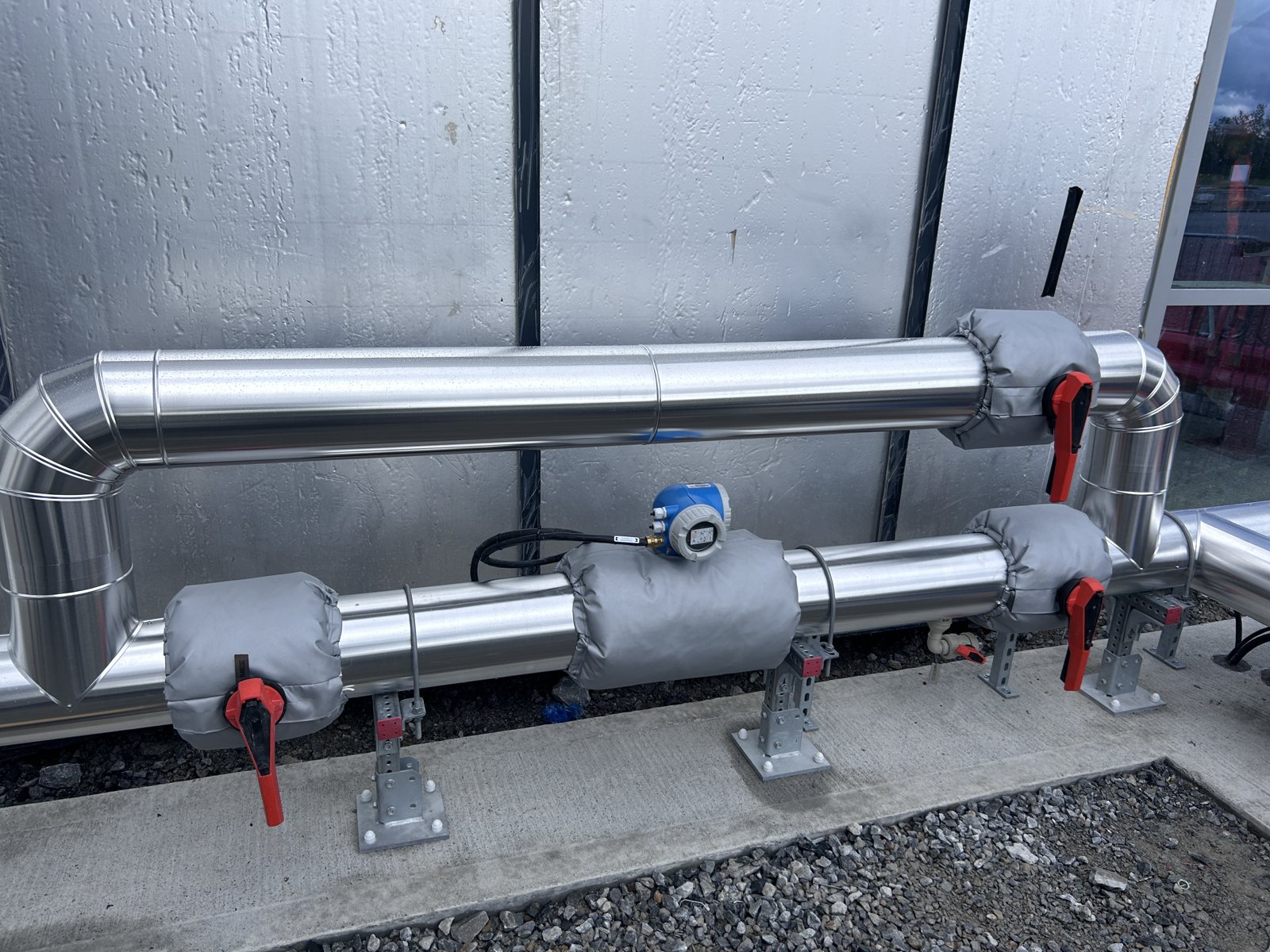 External insulated pipework with plain aluminium cladding and removable valve covers supplied and installed.
